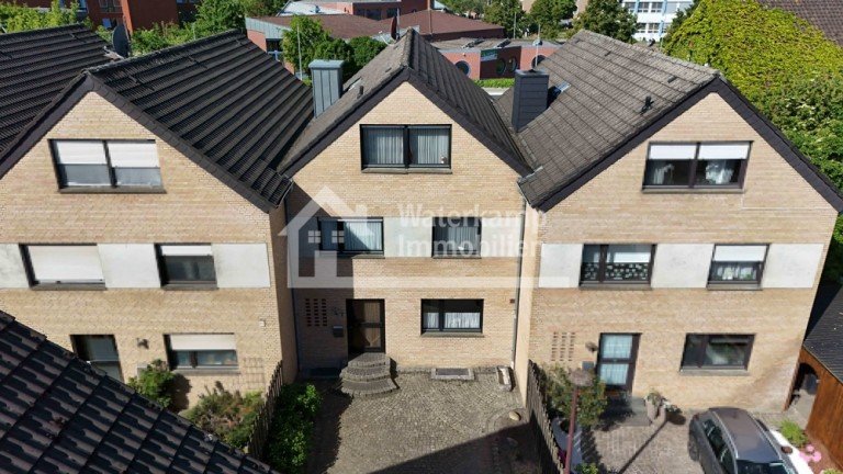 Luftaufnahme Vorderansicht Nordwalde Reihenmittelhaus Familienfreundliches Reihenmittelhaus mit Sonnengarantie